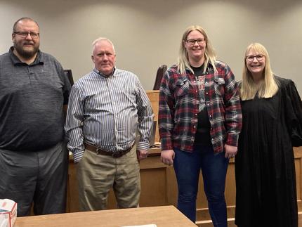 From left: Probation Officer Kyle Hohnholt, graduates Hugh Riley and Abbigail Galles, and Judge Rachel Daugherty.