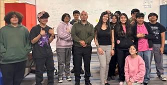 Officers Estaban Davila and Anabelle Garcia (center) with a group at the South Omaha Boys and Girls Club. 
